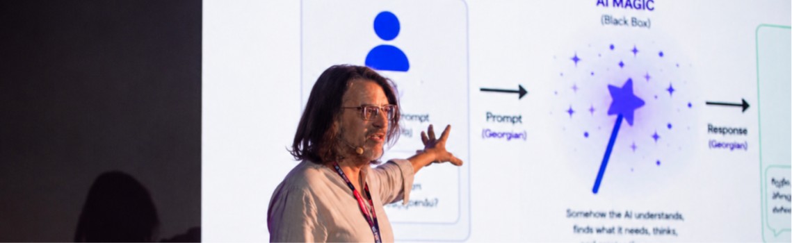 Your author, a stereotypical middle-aged white male, standing on a stage in front of a slide describing AI as “magic”